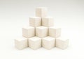 stack in the shape of a pyramid of stacked wooden cubes 3d illus