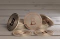 Stack of shiny copper bitcoins as example for blockchain and crypto currency spread across a wooden table