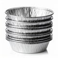 Stack of Shiny Silver Aluminum Foil Baking Cups on White Backdrop Royalty Free Stock Photo