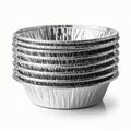 Stack of Shiny Silver Aluminum Foil Baking Cups on White Surface Royalty Free Stock Photo
