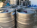 Stack of shiny stainless steel beer kegs outside of pub Royalty Free Stock Photo
