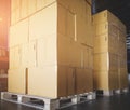 Stack of shipment cardboard boxes on wooden pallet. package box, packaging. Manufactiring warehouse cargo delivering goods. Royalty Free Stock Photo