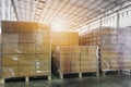 Stack of shipments boxes on wooden pallets. Interior of warehouse storage
