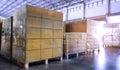 Stack of shipments boxes on wooden pallets. Interior of warehouse storage Royalty Free Stock Photo