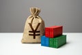 Stack of shipping containers and japanese yen money bag. Royalty Free Stock Photo