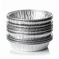 Stack of Silver Aluminum Foil Baking Pans on White Surface Royalty Free Stock Photo