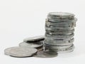 Stack of silver coins on a white surface representing savings and wealth Royalty Free Stock Photo