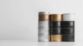 Stack of Silver Golden and Black Metal Tin Containers in a White Background Royalty Free Stock Photo