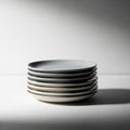 Emphasizes the smooth glossy texture of the plates creating a calm and Royalty Free Stock Photo