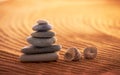 Stack of six zen stones in a very beautiful relaxing sunset beach setting Royalty Free Stock Photo