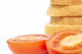 Stack sliced bread with tomatoes isolated macro on white background