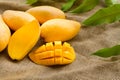 Stack of Sliced mango fruit with tropical leaf