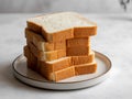 Stack of sliced white bread on a white plate Royalty Free Stock Photo