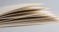 Stack of slightly open beige paper Royalty Free Stock Photo