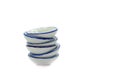 Stack of small bowls on white background Royalty Free Stock Photo
