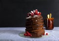 Stack of Small chocolate Pancakes in chocolate syrup . and fresh Royalty Free Stock Photo