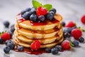 A stack of small pancakes with berries. Generative AI