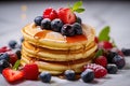 A stack of small pancakes with berries. Generative AI