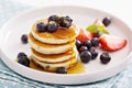 Stack of small pancakes with fresh berries Royalty Free Stock Photo