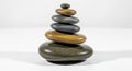 Stack of smooth, flat pebbles arranged in a balanced structure. The stones vary in Royalty Free Stock Photo