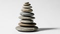 Stones is carefully balanced forming a vertical cairn against a plain Royalty Free Stock Photo