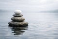 Zen Stone Stack Balanced on Water with Ripples stones Royalty Free Stock Photo