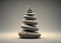 A stack of smooth pebbles is arranged in a pyramid shape, with Royalty Free Stock Photo