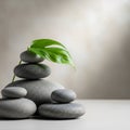 A stack of smooth, round gray stones is artfully arranged against a soft, neutral background. A Royalty Free Stock Photo