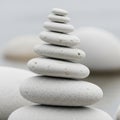 Stack of smooth, round, white pebbles arranged in a balanced tower on a blurred background. Each Royalty Free Stock Photo