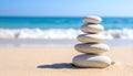 A stack of smooth, white pebbles is arranged on a sandy beach. Royalty Free Stock Photo