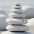 A stack of smooth, white stones balances with precision. Each stone slightly varies in size, Royalty Free Stock Photo