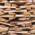 Stack of split firewood with rough texture and natural variations in color Royalty Free Stock Photo