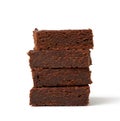 Stack of square baked pieces of brownie chocolate cake isolated on a white background