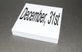 On a stack of square note paper is written December 31  the last day of the year  on a black background Royalty Free Stock Photo