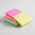 Stack of square sticky notes in various colors: yellow, pink, orange, green, and blue Royalty Free Stock Photo