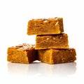 Stack of squares of pumpkin fudge on a white background Royalty Free Stock Photo
