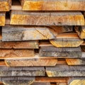 Stack of stacked Lumber. Dried wood boards with a crack. Different types of wood. Square. Toned. Royalty Free Stock Photo