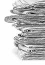 A stack of stacked newspapers on a white background