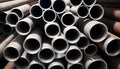 Stack of stainless steel pipes background