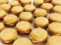 Stack of standard sized hamburgers background. 3D illustration