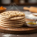 A stack of steaming flatbreads, likely pita, is placed on a wooden cutting board. Each Royalty Free Stock Photo