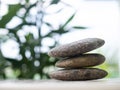 Stack Stone on blur tree plant.