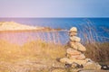 Stack stone over ocean seacoast skyline Royalty Free Stock Photo