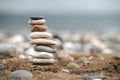 Stack of Stone over the sand. Balance and stability concept with stones.