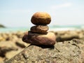 Stack Stone Pebble Zen Balance with blur Water Sea Beach Sand Calm Concept Spa Stability Spiritual,Pyramid Rock at Coast Island on Royalty Free Stock Photo