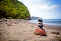 Stack of stones balanced on rocky beach of Pololu Valley, Big Island, Hawaii