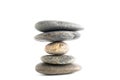 Stack of stones balancing on white background
