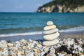 Stack of stones on the beach in summer. Royalty Free Stock Photo