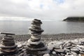 Stack of stones on fjord background Royalty Free Stock Photo