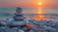 Stack of stones on a pebble beach at sunset Royalty Free Stock Photo
